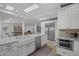 Bright, modern kitchen with a farmhouse sink and stainless steel appliances at 11601 N 85Th St, Scottsdale, AZ 85260