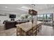 Open concept living area with fireplace, skylight, and sliding doors to the backyard at 11601 N 85Th St, Scottsdale, AZ 85260