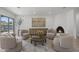 Bright living room featuring a fireplace, stylish seating, and lots of natural light at 11601 N 85Th St, Scottsdale, AZ 85260