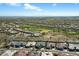 Expansive aerial view of the community featuring a golf course and meticulously planned residential areas at 12519 W Oyer Ln, Peoria, AZ 85383