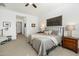 This bedroom offers neutral colors and a ceiling fan to keep cool at 12519 W Oyer Ln, Peoria, AZ 85383