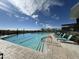 Scenic community pool with a clear blue swimming lane provides a refreshing and well-maintained aquatic experience at 12519 W Oyer Ln, Peoria, AZ 85383