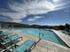 Enjoy this outdoor community pool featuring sun loungers with a scenic desert view great for relaxation and recreation at 12519 W Oyer Ln, Peoria, AZ 85383