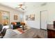 The living room has tile floors, a ceiling fan, and natural lighting at 12519 W Oyer Ln, Peoria, AZ 85383