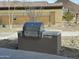 Modern outdoor grill with a sleek stainless steel finish and ample counter space, perfect for entertaining at 12519 W Oyer Ln, Peoria, AZ 85383