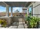 Outdoor kitchen featuring a stainless steel grill, storage, and a bar top with seating at 12519 W Oyer Ln, Peoria, AZ 85383