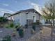 Charming single story home with stone accents, desert landscaping and views of blue sky at 12519 W Oyer Ln, Peoria, AZ 85383