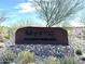 Community Clubhouse signage at Mystic featuring desert landscaping, and native vegetation at 12519 W Oyer Ln, Peoria, AZ 85383