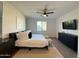 Main bedroom featuring modern furnishings, a plush bed, and ample natural light at 13342 W Lariat Ln, Peoria, AZ 85383