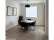 Dining area featuring modern furnishings, tile flooring, and bright natural light from the adjacent sliding door at 13342 W Lariat Ln, Peoria, AZ 85383