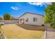 This spacious backyard features a low-maintenance lawn and privacy fencing at 13342 W Lariat Ln, Peoria, AZ 85383