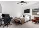 Bedroom featuring a desk, tv, and a seating area at 13342 W Lariat Ln, Peoria, AZ 85383