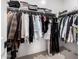 Walk-in closet filled with hanging clothes and shelves at 13342 W Lariat Ln, Peoria, AZ 85383