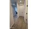 Hallway view to the kitchen showing neutral paint and ceramic tile at 13342 W Lariat Ln, Peoria, AZ 85383