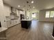 Bright, open kitchen boasts modern appliances and a large island, perfect for entertaining at 13342 W Lariat Ln, Peoria, AZ 85383