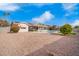 Expansive backyard with a pool, patio, and low-maintenance desert landscaping at 13747 W Tartan Dr, Sun City West, AZ 85375