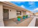 Charming single-story home with beautiful pots and plants on front walkway at 13747 W Tartan Dr, Sun City West, AZ 85375