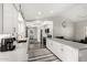 Contemporary kitchen featuring white cabinetry, stainless appliances, and an open layout at 13747 W Tartan Dr, Sun City West, AZ 85375