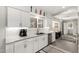 Modern kitchen with stainless steel appliances, white subway tile backsplash, and ample counter space at 13747 W Tartan Dr, Sun City West, AZ 85375