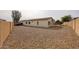 Spacious backyard with low maintenance desert landscaping and block fencing for privacy at 15222 N 138Th Dr, Surprise, AZ 85379