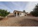 Backyard featuring low maintenance desert landscaping and a covered patio at 15222 N 138Th Dr, Surprise, AZ 85379