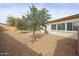 This backyard features low maintenance landscaping, and a view of the home at 15222 N 138Th Dr, Surprise, AZ 85379