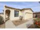 Attractive single-story home with a stucco exterior, tile roof, and low-maintenance desert landscaping in the front yard at 15222 N 138Th Dr, Surprise, AZ 85379