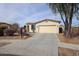 Inviting single-story home with desert landscaping and a spacious two car garage at 15222 N 138Th Dr, Surprise, AZ 85379