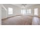 Sun-filled living room offering multiple windows and a light color palette at 15222 N 138Th Dr, Surprise, AZ 85379