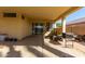 Covered patio area with sliding glass doors providing seamless indoor-outdoor living and space for entertainment at 15558 N 136Th Ln, Surprise, AZ 85374