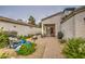 Charming back patio featuring a cozy seating area, a grill, and access to meticulously landscaped outdoor spaces at 16118 W Vista North Dr, Sun City West, AZ 85375