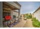 Inviting back patio with comfortable seating, a fire pit, lush landscaping and a ceiling fan at 16118 W Vista North Dr, Sun City West, AZ 85375