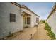 Charming front entry with a decorative door and a landscaped walkway leading to a private courtyard area at 16118 W Vista North Dr, Sun City West, AZ 85375