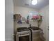 Efficient laundry room with modern washer and dryer units at 16118 W Vista North Dr, Sun City West, AZ 85375