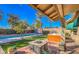 Beautiful backyard featuring a pool, hot tub, and a cozy patio area for outdoor enjoyment at 16402 N 48Th Way, Scottsdale, AZ 85254