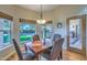 Bright breakfast nook features backyard views and a wooden table, with seating for four at 16402 N 48Th Way, Scottsdale, AZ 85254