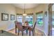 Cozy breakfast nook with natural light, backyard views, and a wooden table with seating for four at 16402 N 48Th Way, Scottsdale, AZ 85254