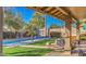 Charming covered patio offering serene views of the pool and meticulously maintained backyard at 16402 N 48Th Way, Scottsdale, AZ 85254