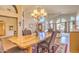 Bright dining area offering an elegant chandelier and scenic views at 16402 N 48Th Way, Scottsdale, AZ 85254