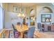 Elegant dining area with a rustic table and stylish chandelier at 16402 N 48Th Way, Scottsdale, AZ 85254