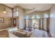 Cozy living room featuring a fireplace and large windows at 16402 N 48Th Way, Scottsdale, AZ 85254