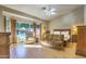 Spacious main bedroom with hardwood floors, a sitting area by a large window, and a ceiling fan at 16402 N 48Th Way, Scottsdale, AZ 85254