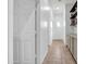 Hallway featuring storage cabinets, floating shelves, and tasteful decorative details at 16813 W Hammond St, Goodyear, AZ 85338