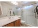 Clean bathroom with a single sink vanity and a frosted glass shower at 1722 N 77Th Gln, Phoenix, AZ 85035