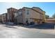 Exterior view of a two-story home with a stone facade and attached garages at 1722 N 77Th Gln, Phoenix, AZ 85035