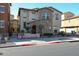 Charming two-story home with a stone facade, front patio and manicured landscaping at 1722 N 77Th Gln, Phoenix, AZ 85035