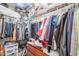 Organized walk-in closet featuring an abundance of hanging space, shelves, and drawers for optimal storage at 1722 N 77Th Gln, Phoenix, AZ 85035