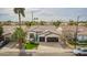 An aerial view of a home with a well-manicured lawn and a two-car garage at 1737 E Marquette Dr, Gilbert, AZ 85234