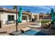 Backyard featuring patio with seating, grill, and grassy area at 1737 E Marquette Dr, Gilbert, AZ 85234