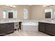 Elegant bathroom featuring dual vanities, mosaic tile accents, and a soaking tub at 1737 E Marquette Dr, Gilbert, AZ 85234